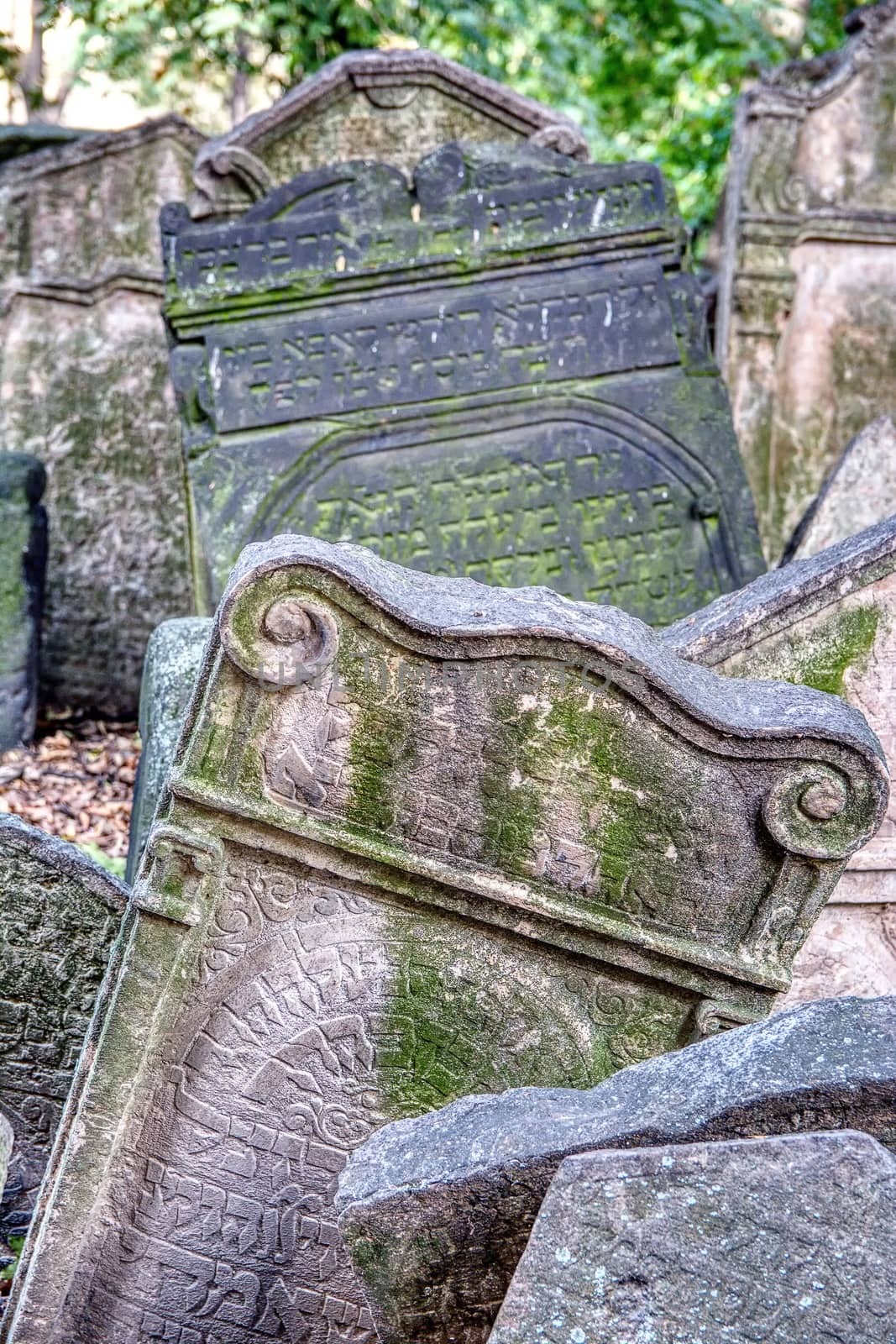 Prague, Czech Republic - September 26, 2018: Tombstones on Old Jewish Cemetery in the Jewish Quarter in Prague.There are about 12000 tombstones presently visible. One of the most important Jewish monument.