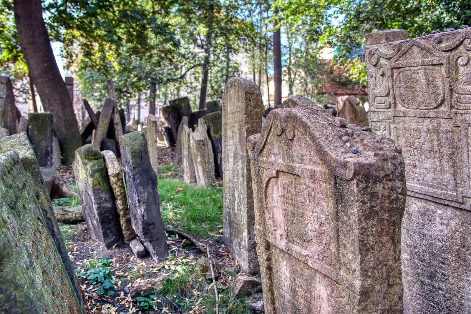 Prague, Czech Republic - September 26, 2018: Tombstones on Old Jewish Cemetery in the Jewish Quarter in Prague.There are about 12000 tombstones presently visible. One of the most important Jewish monument.