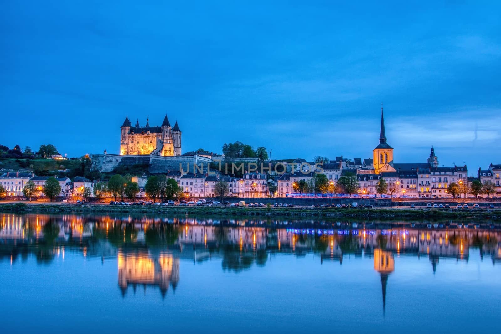 Panorama of Saumur at night with the medieval castle and the Saint-Pierre church, France. by CreativePhotoSpain