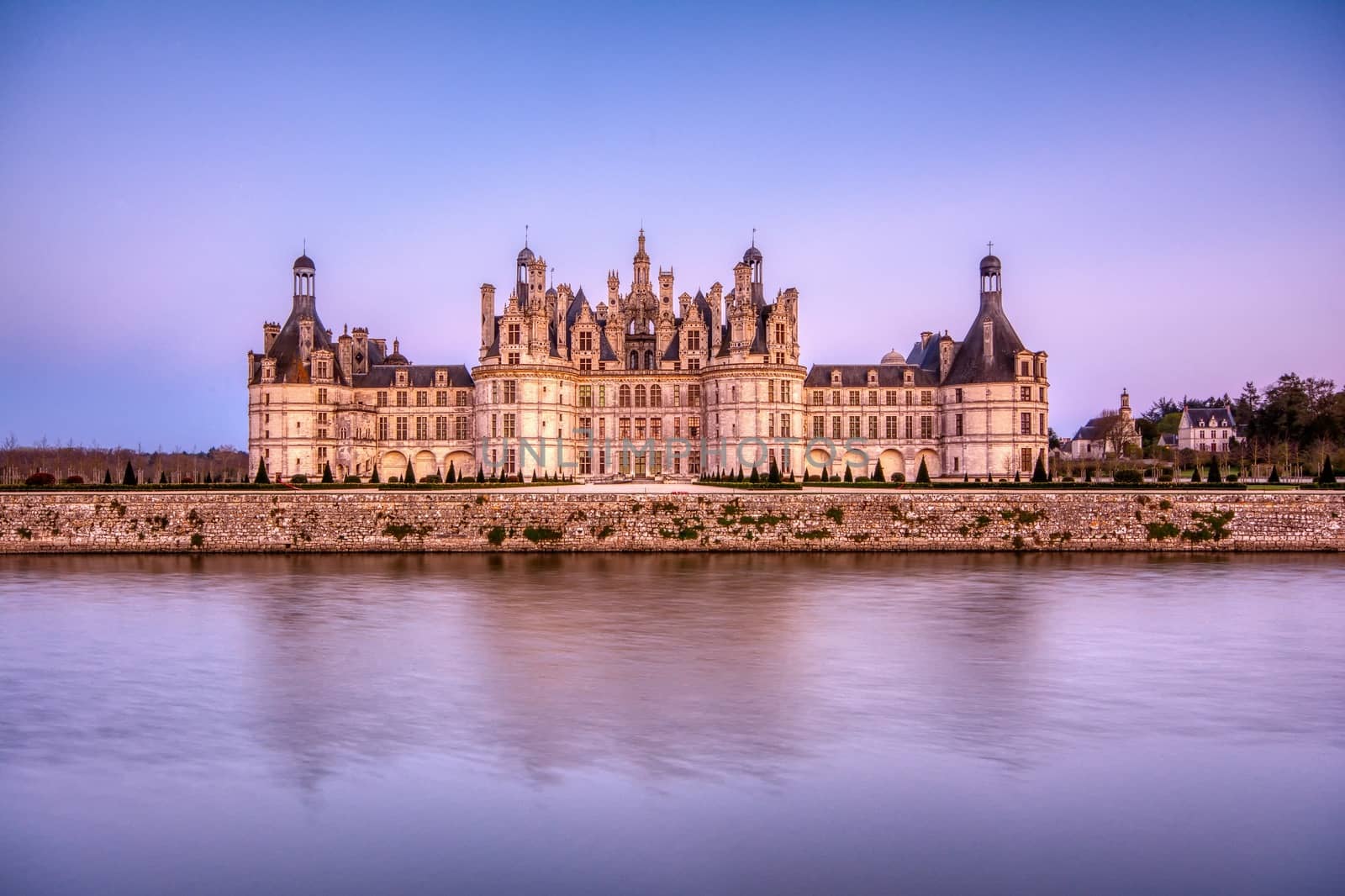 Loire, France - April 14, 2019: The castle of Chambord at sunset, Castle of the Loire, France. Chateau de Chambord, the largest castle in the Loire Valley. A UNESCO world heritage site in France