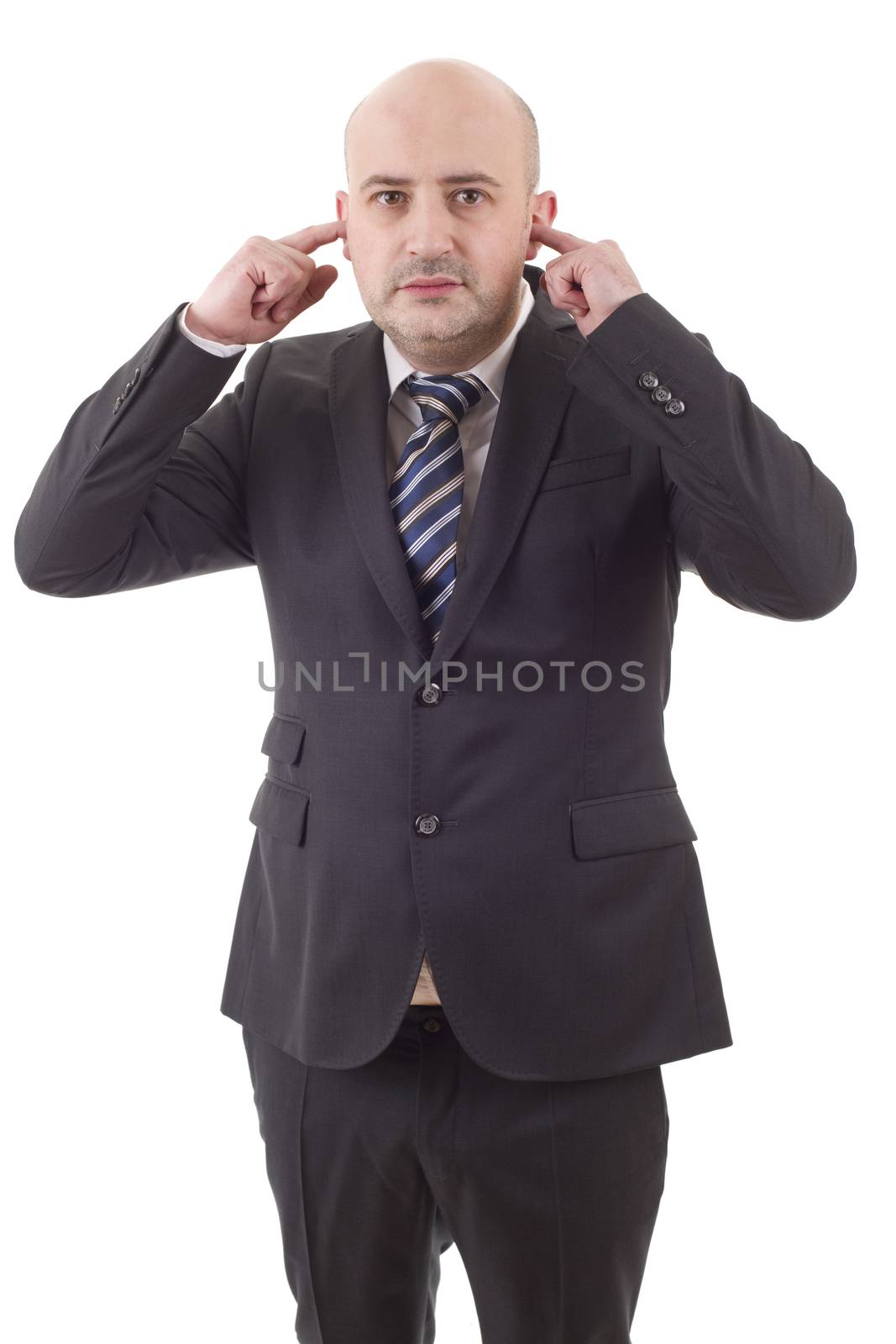 handsome business man covering his ears ignoring noise, isolated