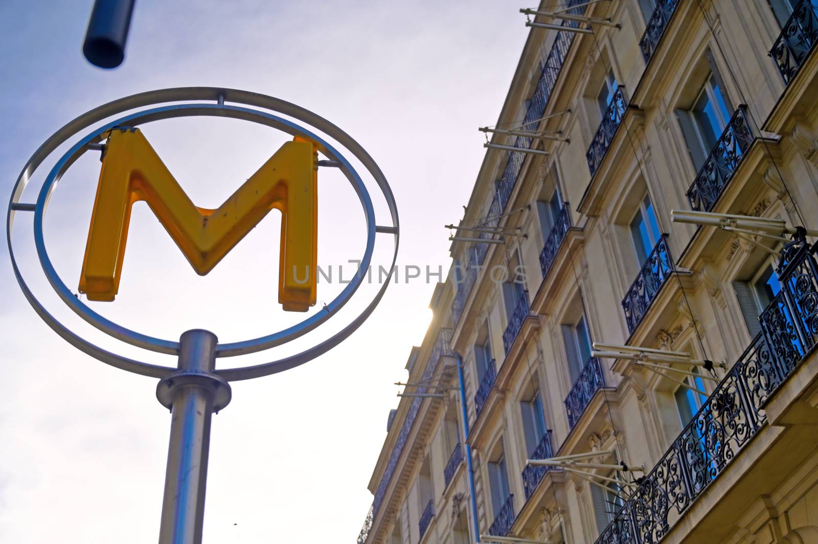 Paris, France - April 21, 2019 - A sign that marks the entrance to a metro station for the Paris underground subway system in France. 