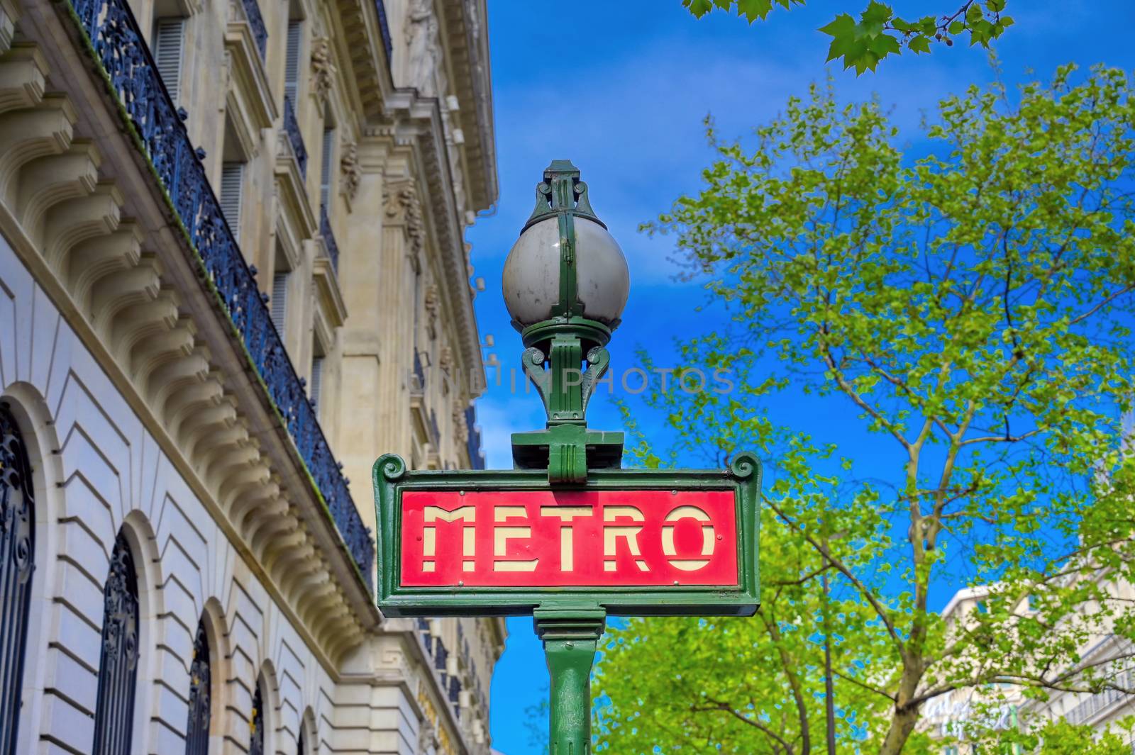 Paris, France - April 21, 2019 - A sign that marks the entrance to a metro station for the Paris underground subway system in France. 