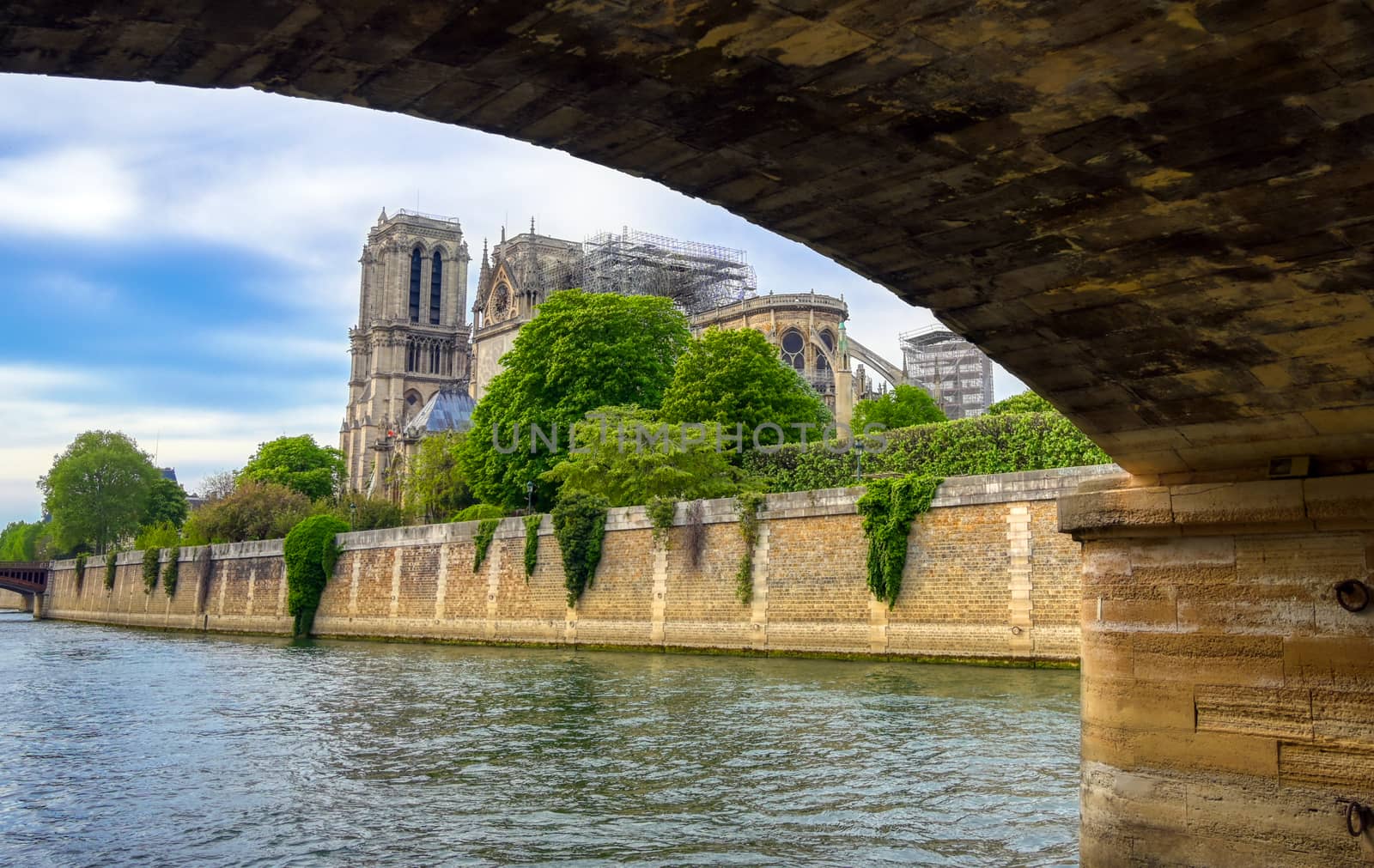 Paris, France - April 21, 2019 - Notre Dame Cathedral on the Seine River in Paris, France after the fire on April 15, 2019.