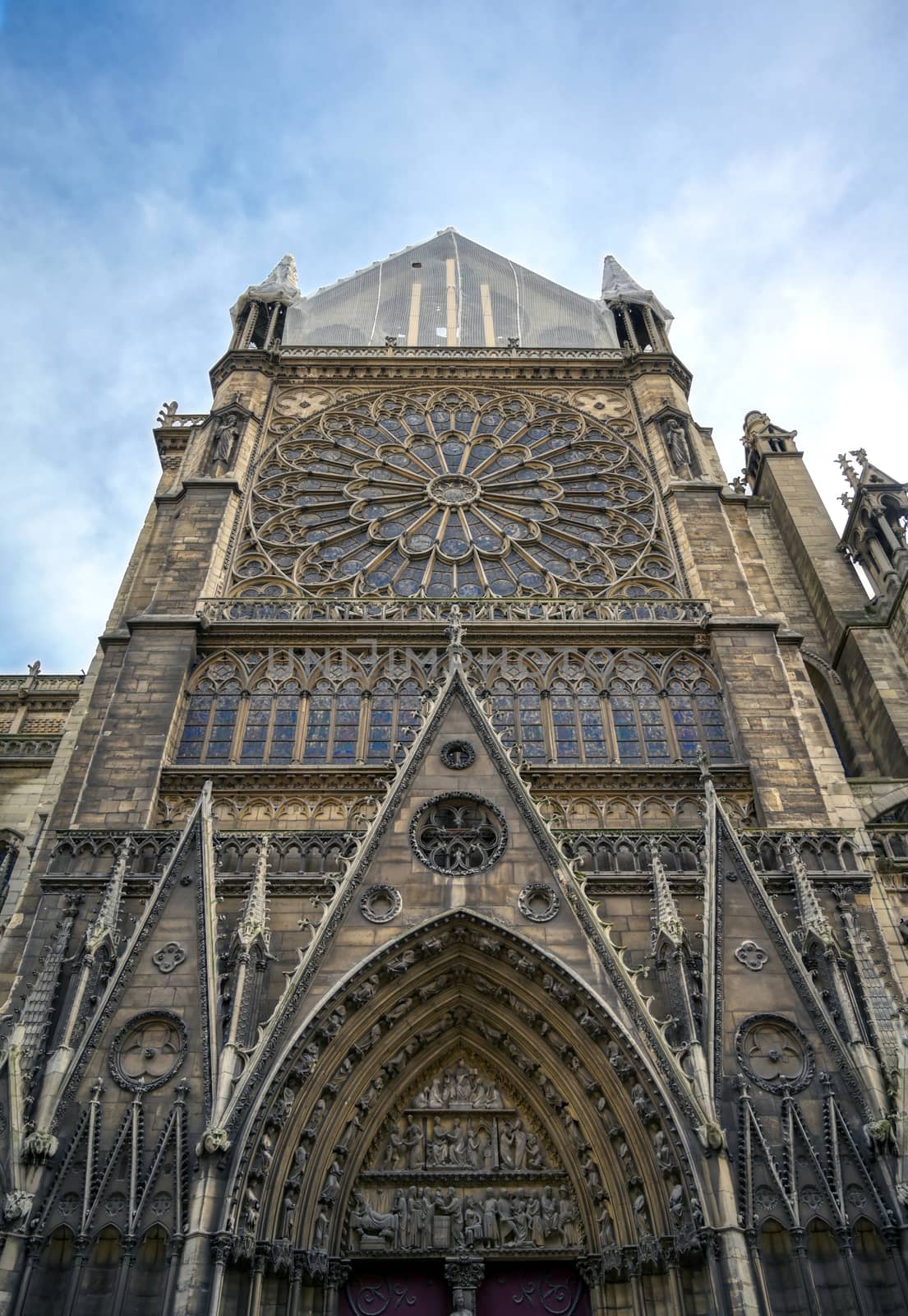 Paris, France - April 21, 2019 - Notre Dame Cathedral on the Seine River in Paris, France after the fire on April 15, 2019.