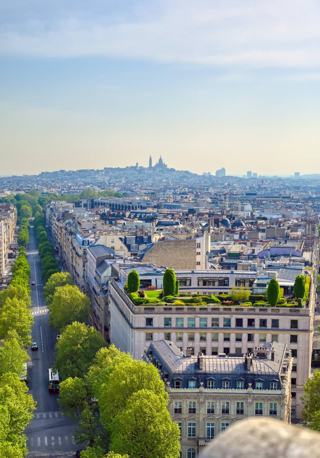 A view of Paris, France from the Arc de Triomphe on a sunny day.