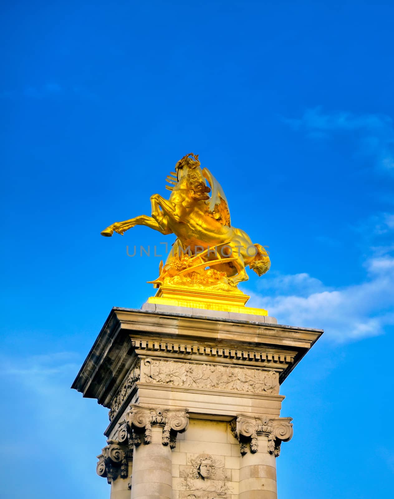 A view of the Pont Alexandre III bridge that spans the Seine River in Paris, France