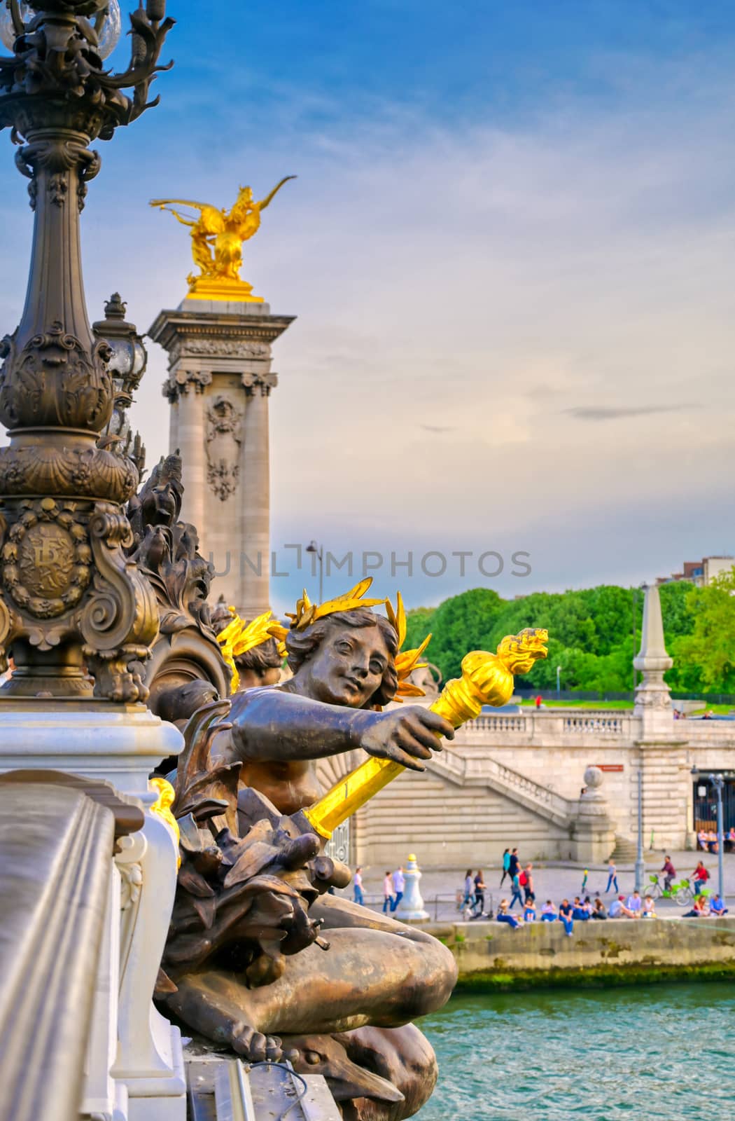 A view of the Pont Alexandre III bridge that spans the Seine River in Paris, France