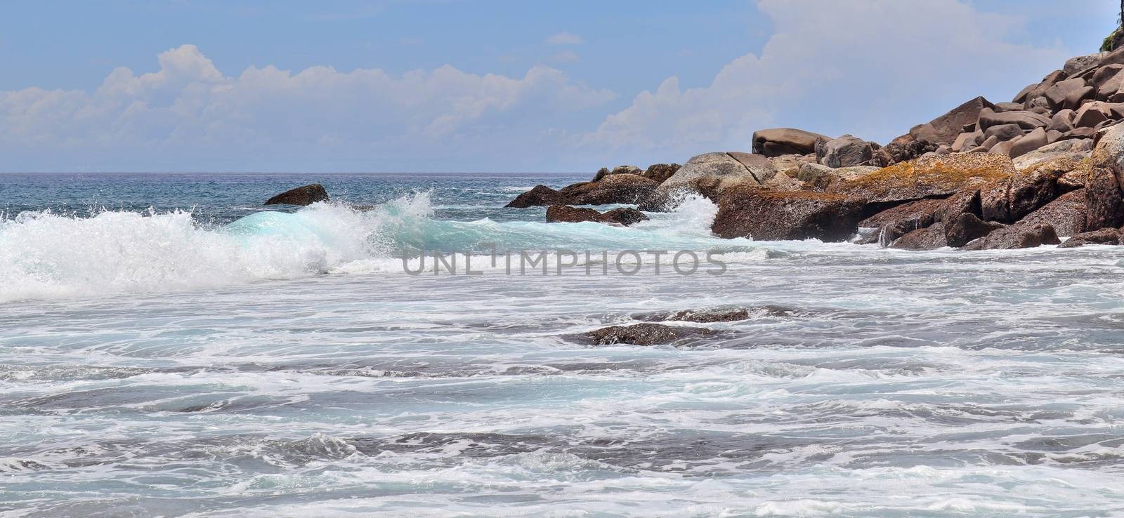 Stunning indian ocean waves at the beaches on the paradise island seychelles.