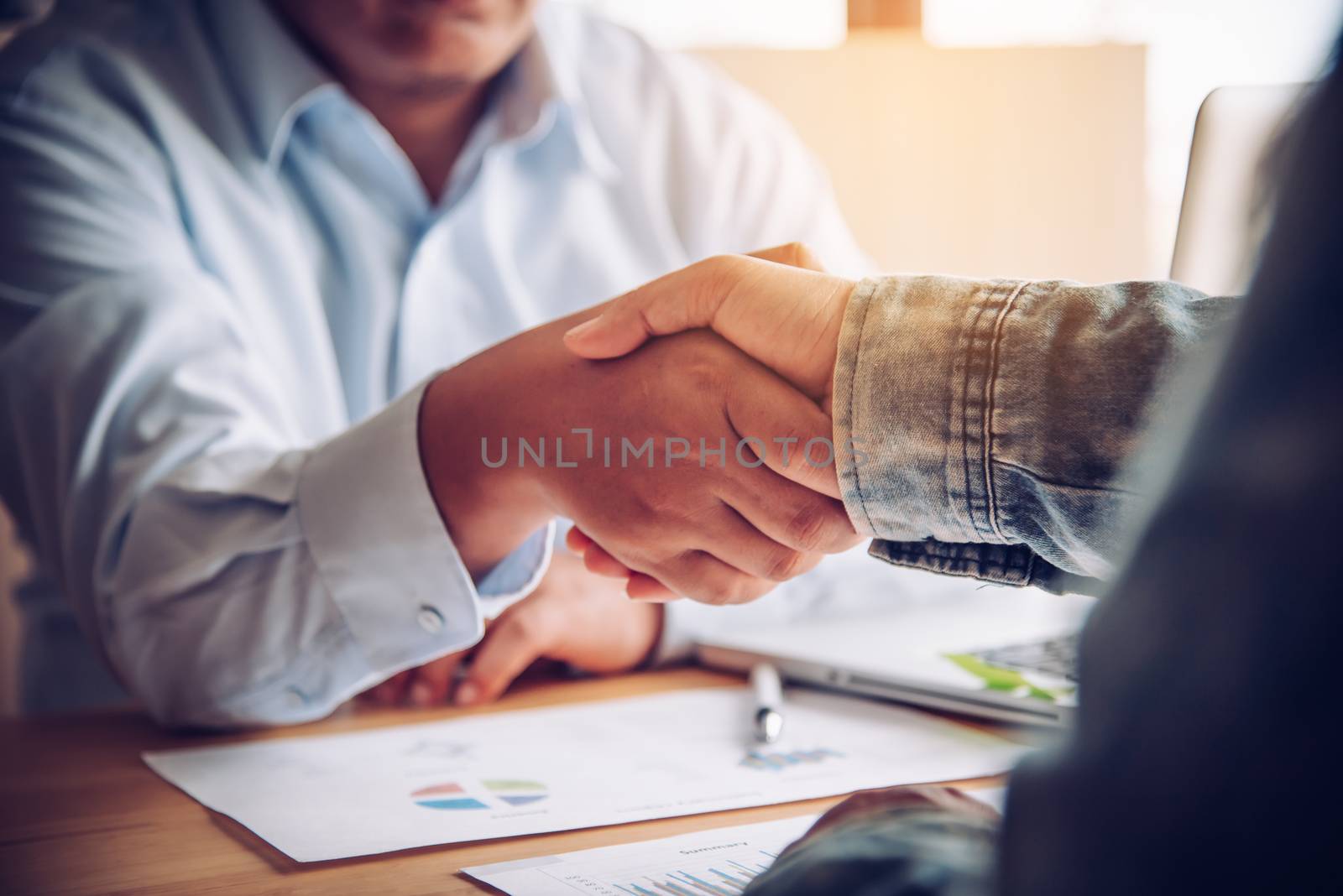 Handshake between joint venture businessmen after good managemen by photobyphotoboy