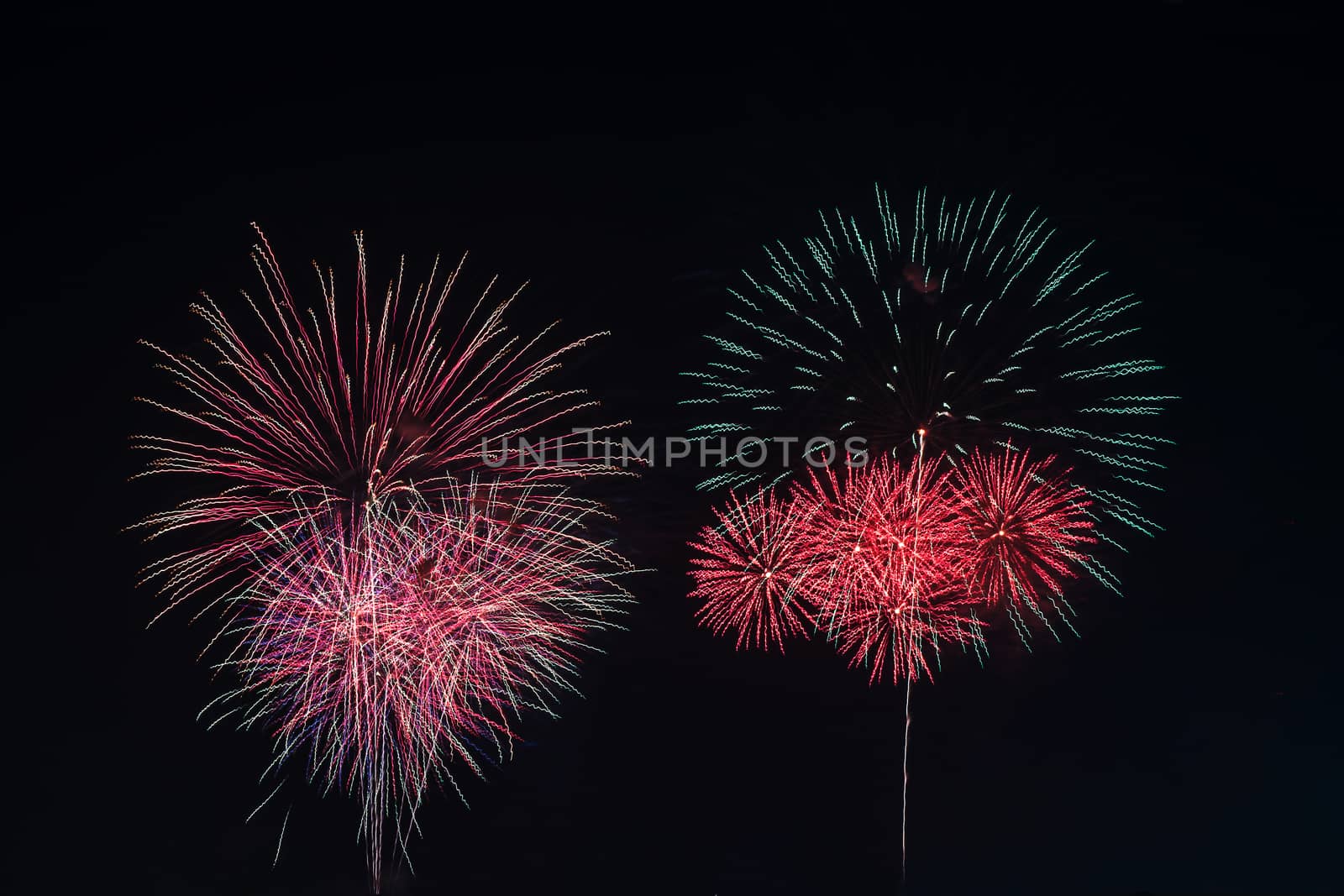 Colorful fireworks display. by NuwatPhoto