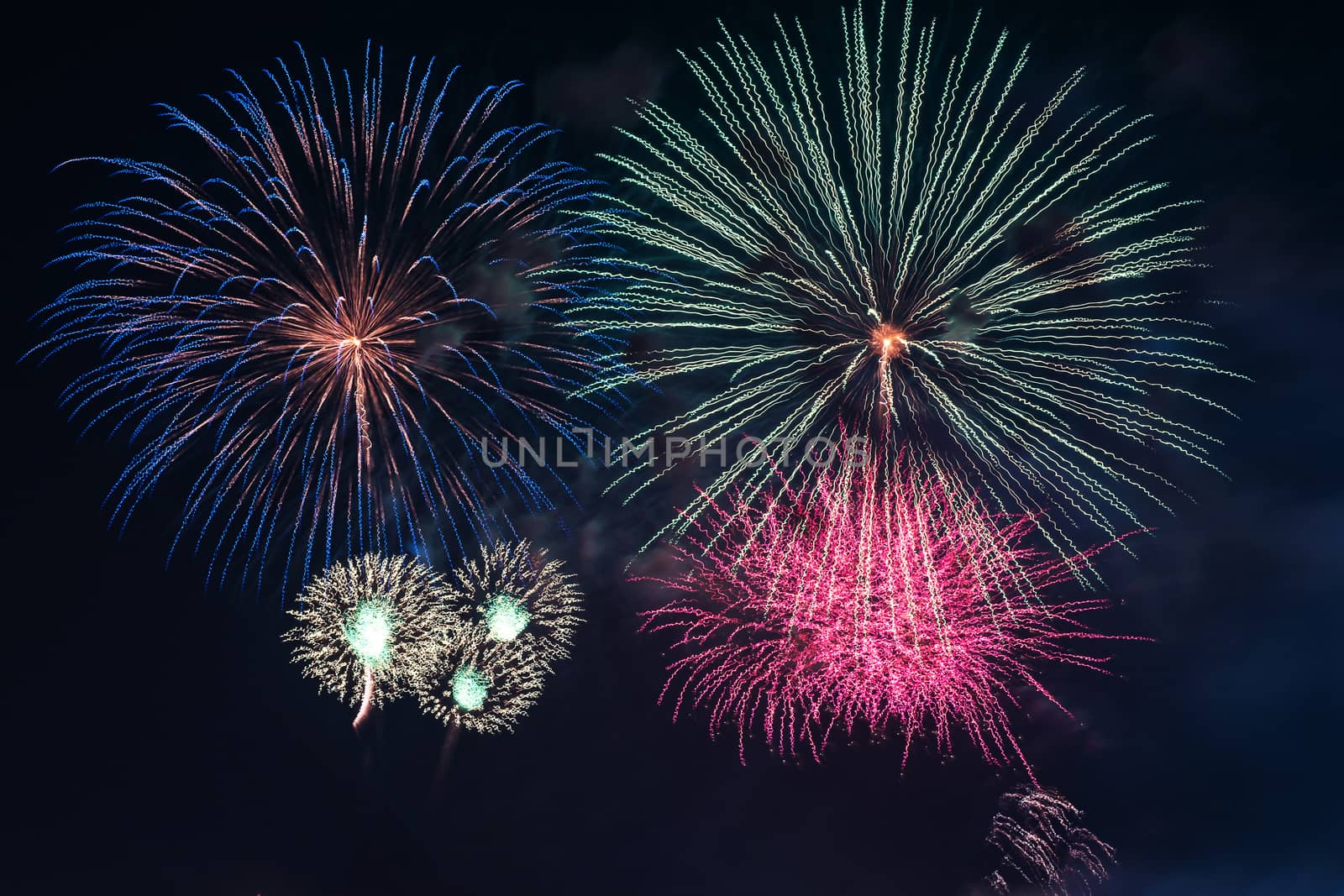 Colorful fireworks display at holiday night.