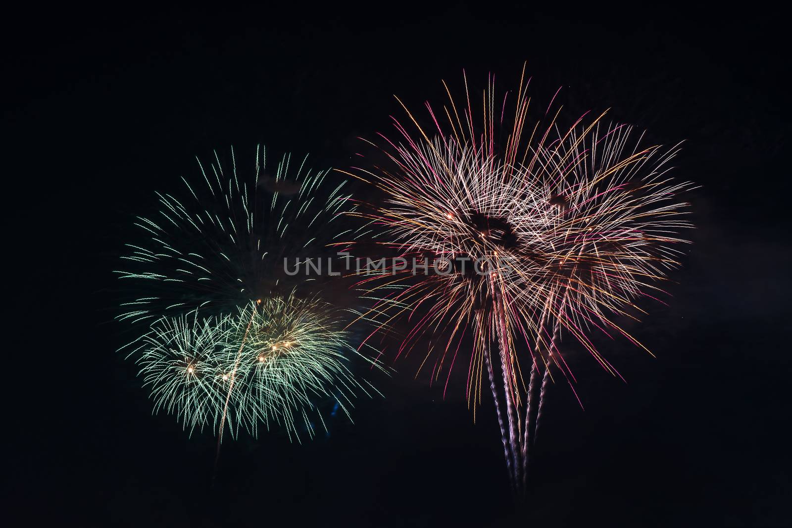 Colorful fireworks display at holiday night.