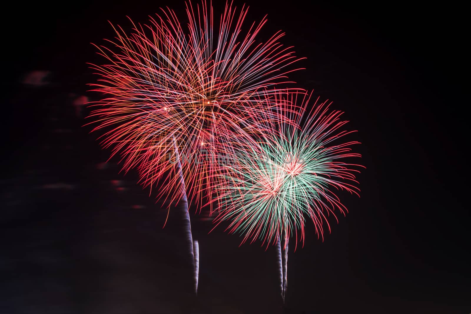 Colorful fireworks display at holiday night.