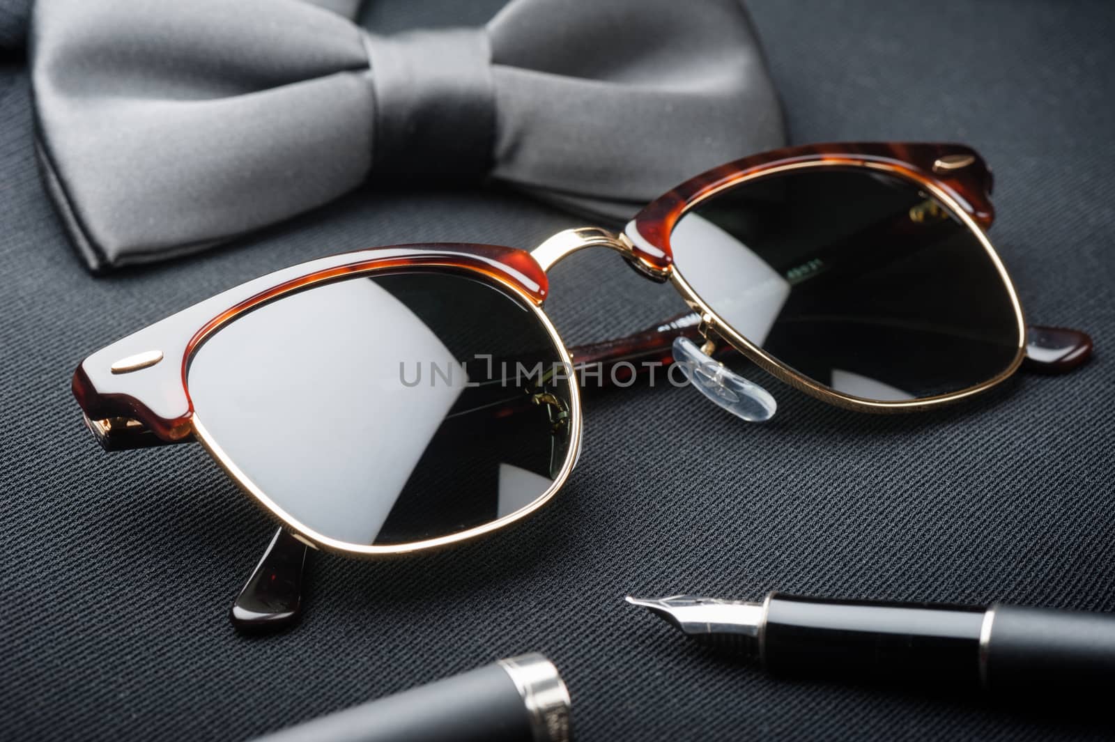 accessories for men, close up at brown sunglasses.