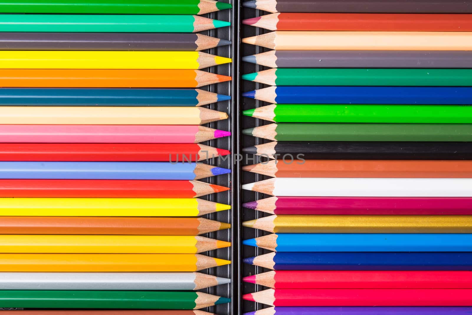 Color Pencils with plastic case isolated on Black Background clo by Bubbers