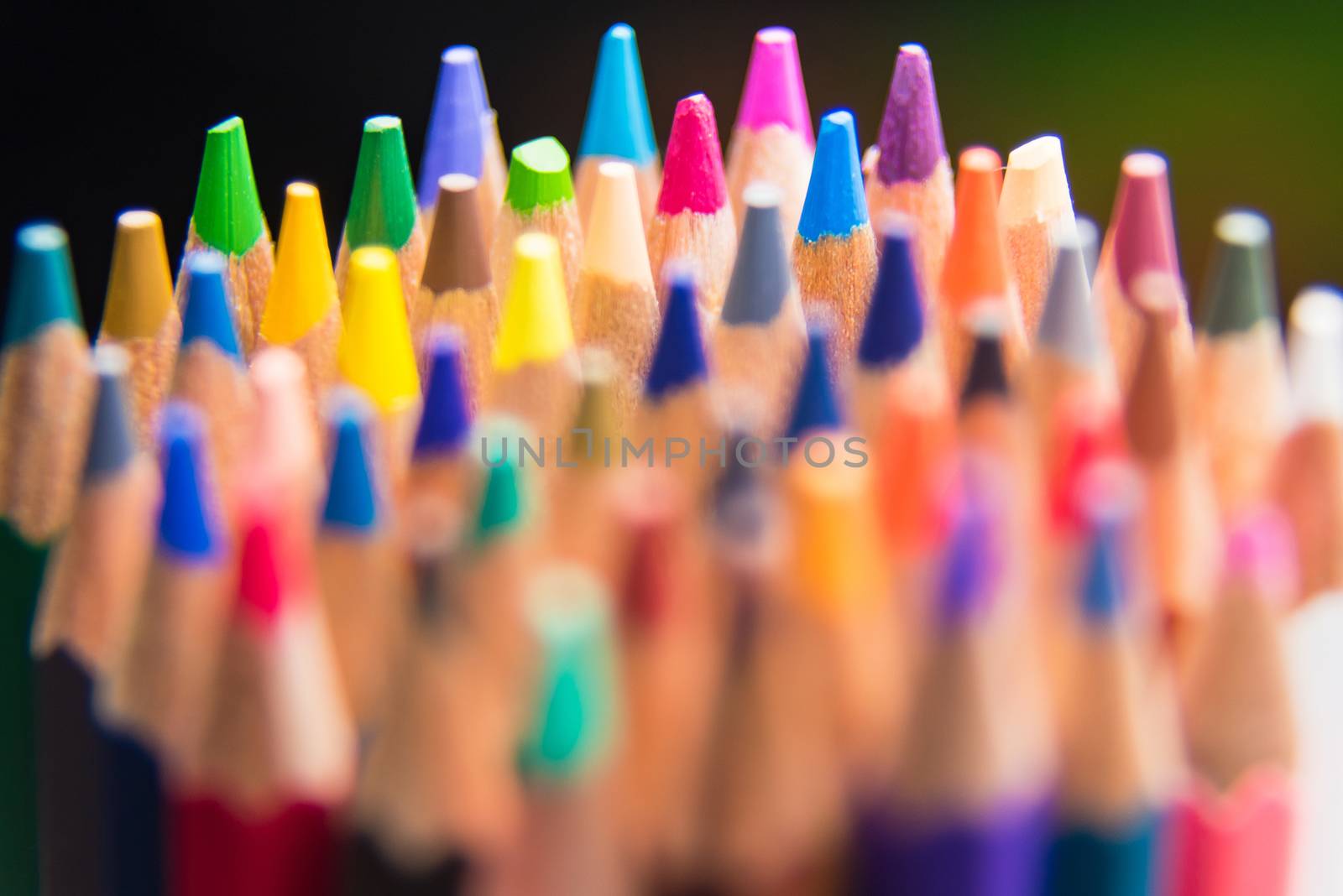 Back to school set multicolored pencils colorful making forms side view on a black backround