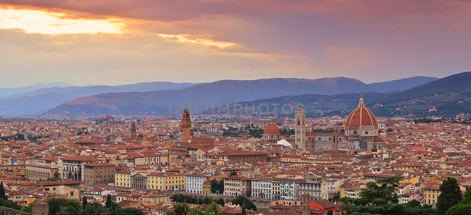 Panorama of Duomo Santa Maria Del Fiore and tower of Palazzo Vecchio at sunset in Florence, Tuscany, Italy