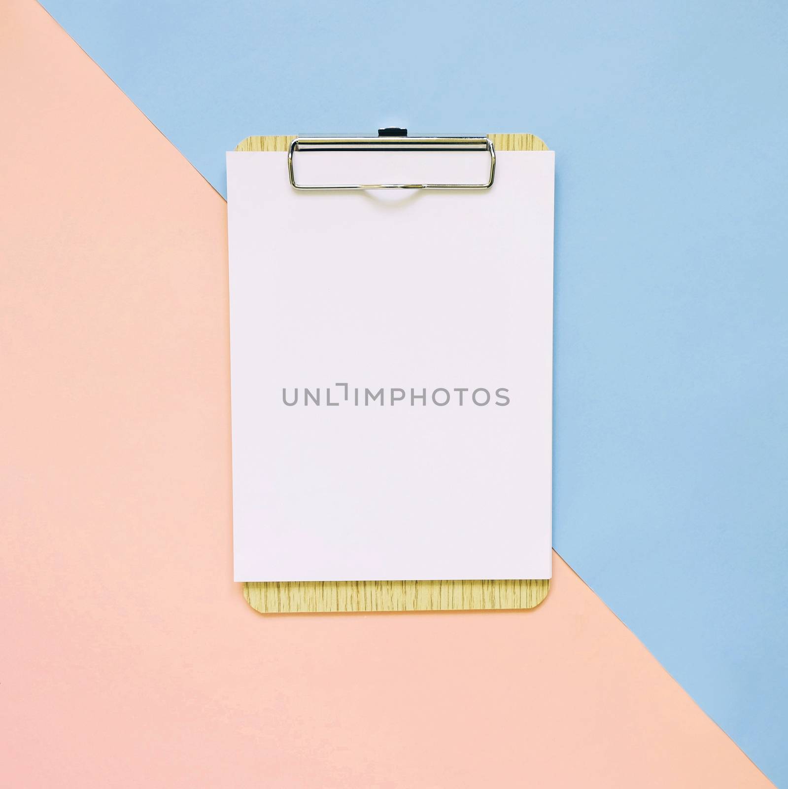 Blank clipboard on pastel color background, minimal style
