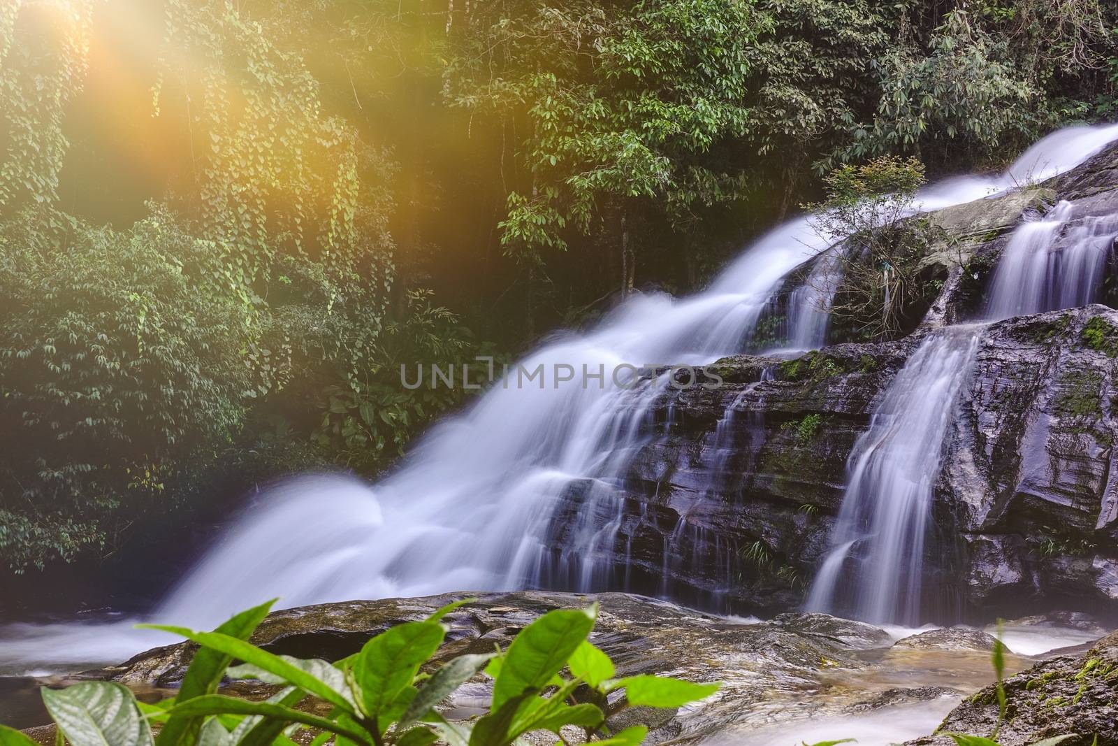 Beautiful landscape of waterfall with light in Chiangmai, Thailand