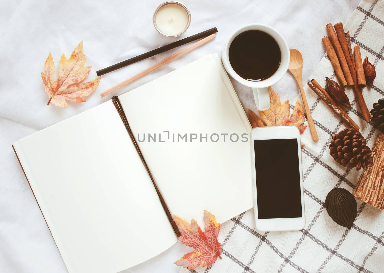Autumn lifestyle concept, blank notebook, smartphone and coffee  by nuchylee