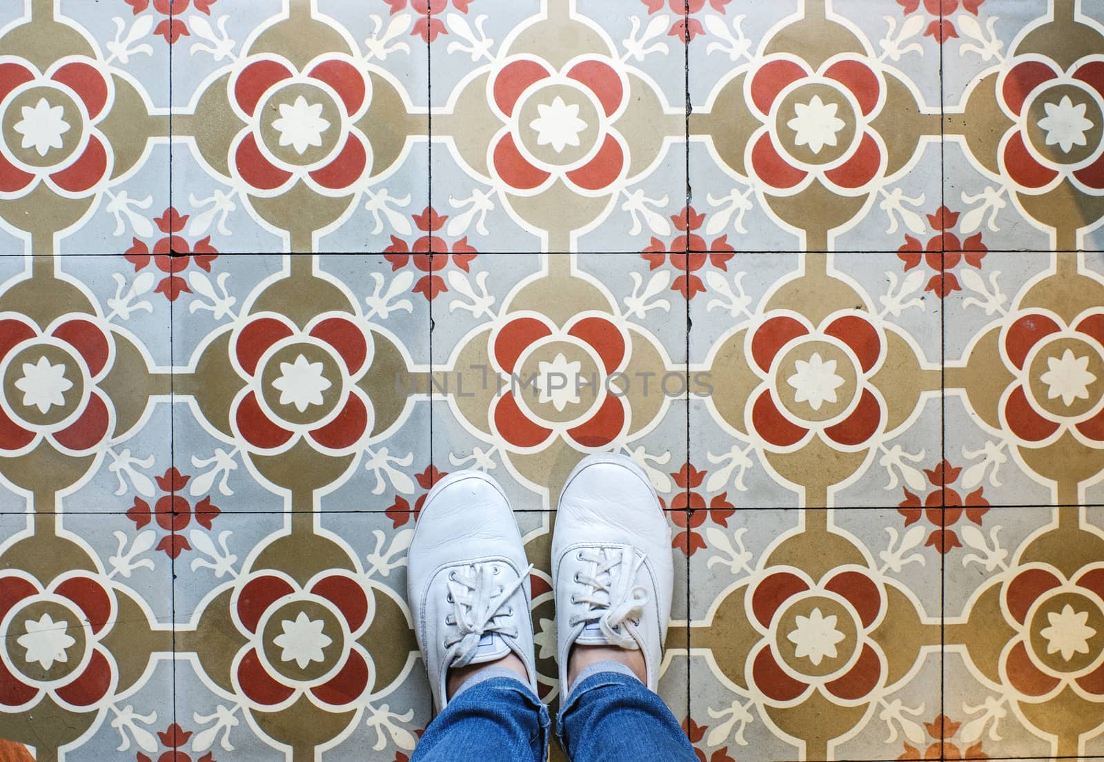 Top view selfie of feet in sneakers shoes on the vintage seamles by nuchylee