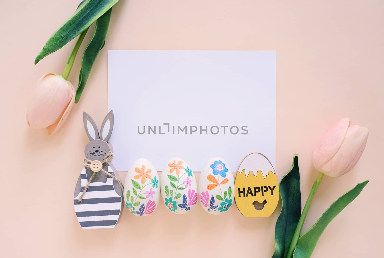 Happy Easter concept with blank card, wooden bunny, colorful eas by nuchylee