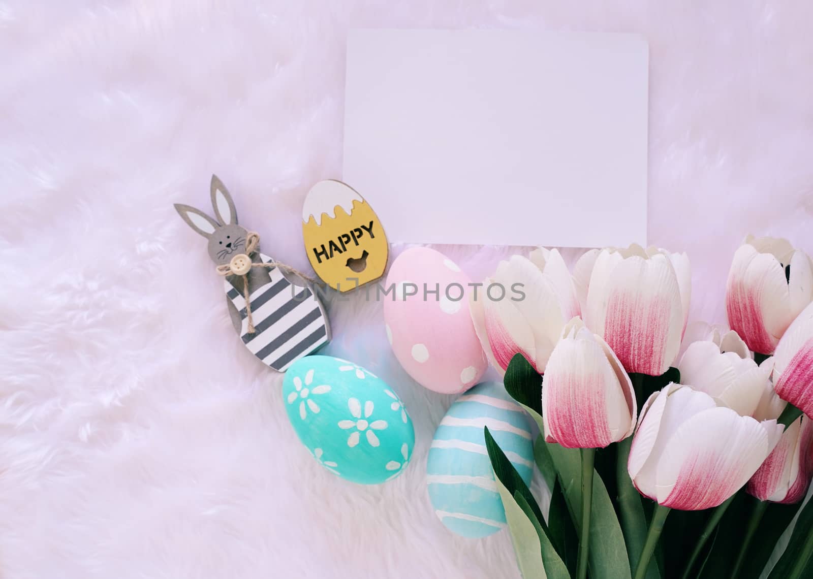 Happy Easter concept with wooden bunny and colorful easter eggs  by nuchylee