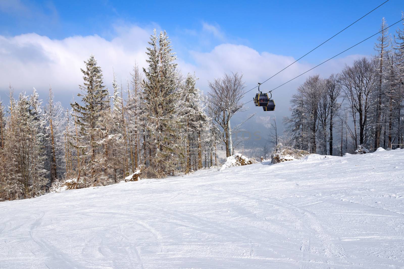 Gondola lift over the ski slope in Szczyrk, Beskid Mountains, Poland