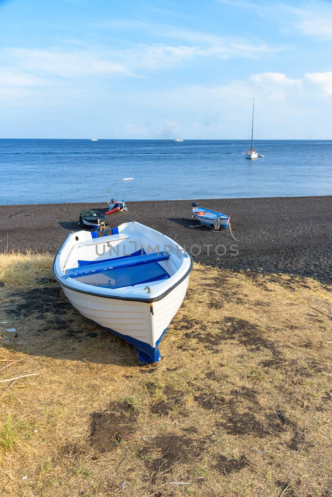 Boat on the black volcanic beach on Stromboli Island, Aeolian Islands, Italy