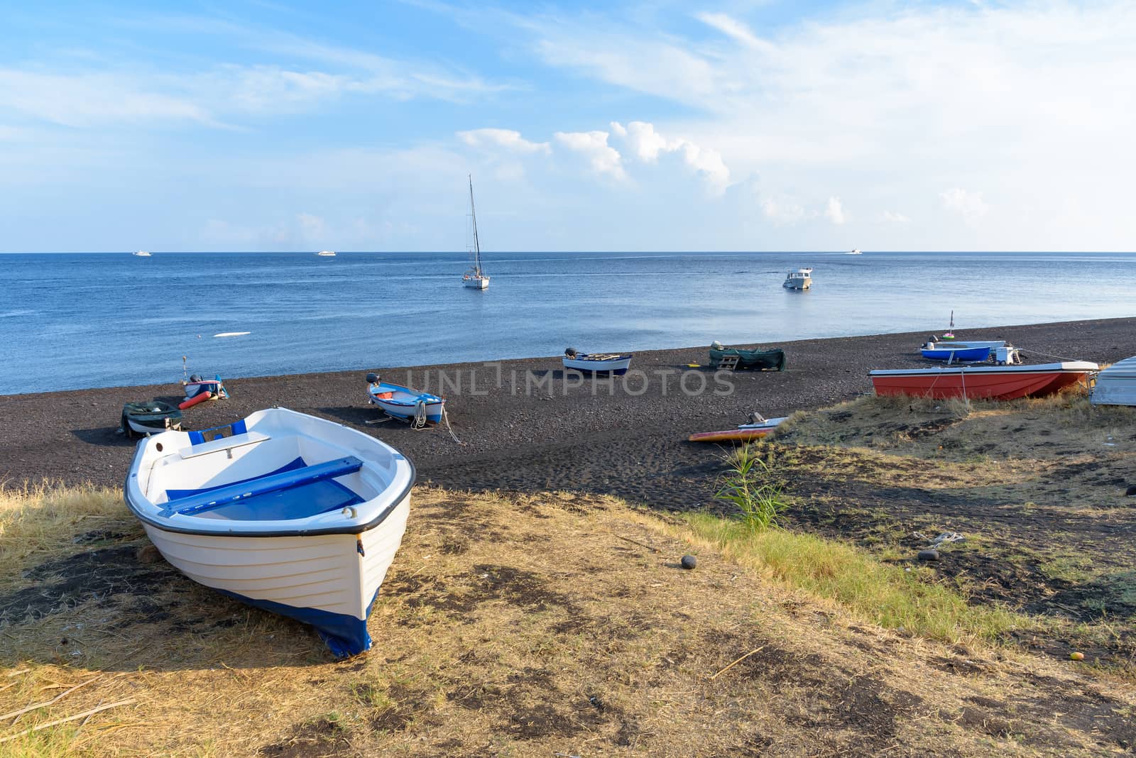 Boat on the black volcanic beach on Stromboli Island, Aeolian Islands, Italy