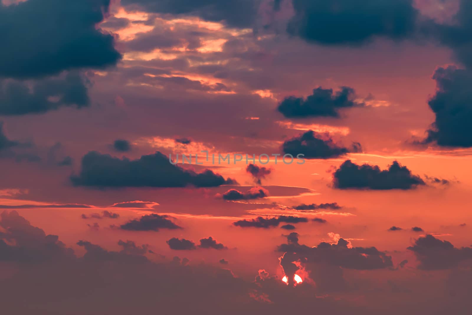 Clouds on the red sky during sunset by mkos83