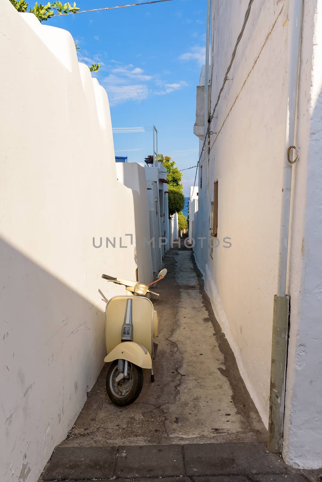 Scooter in narrow street of Stromboli village, Aeolian Islands, Italy