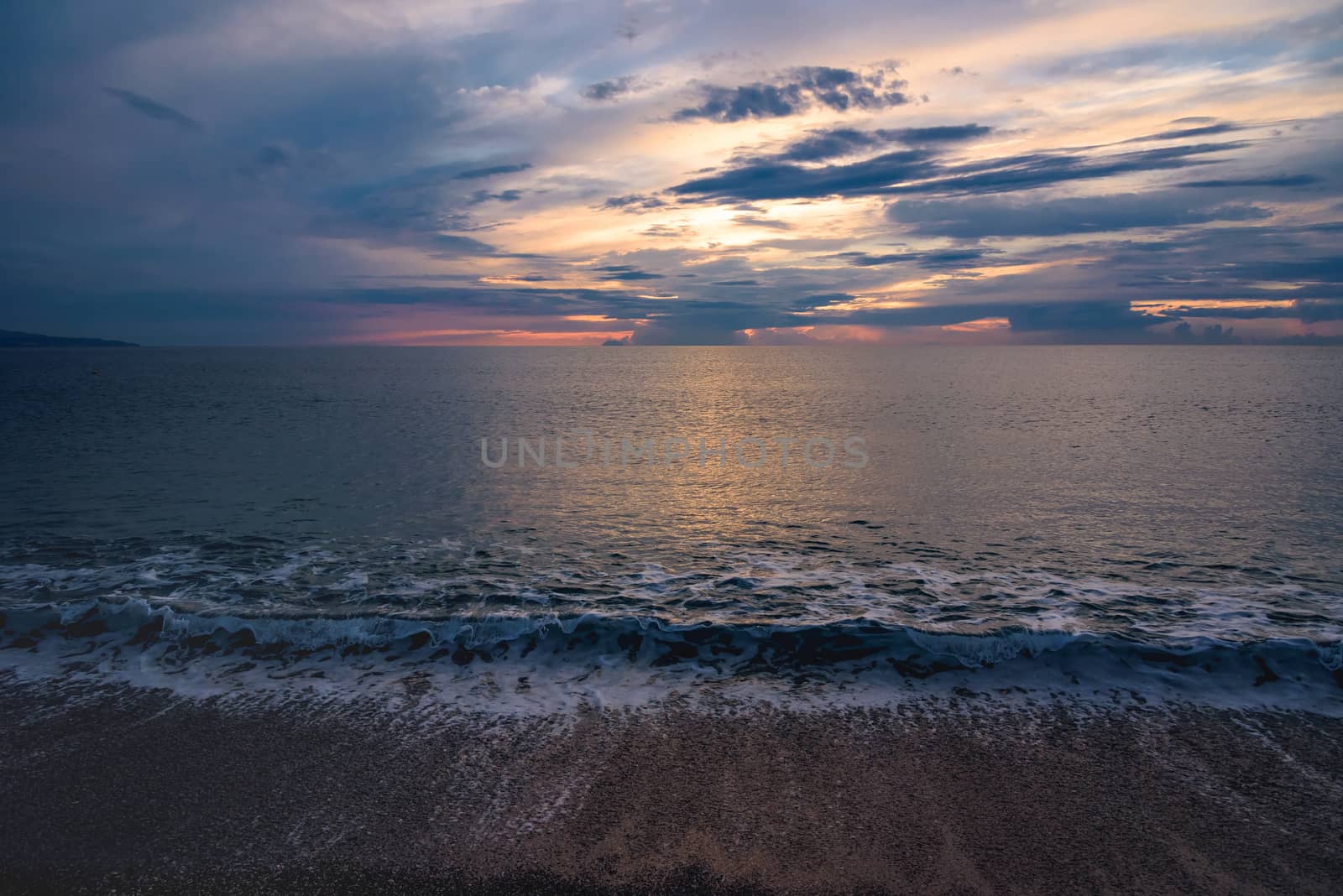 Picturesque sunset on the Calabrian beach in Italy