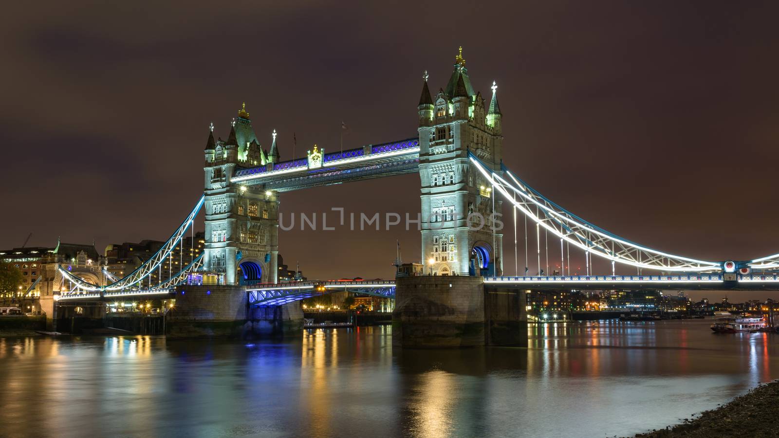 View of thr Tower Bridge in London at night on a cloudy day