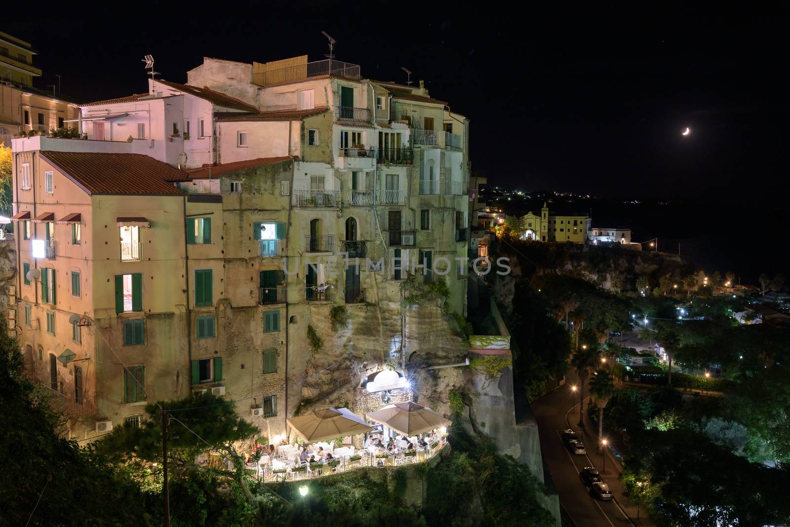 Buildings on a cliff in Tropea by night, Calabria, Italy