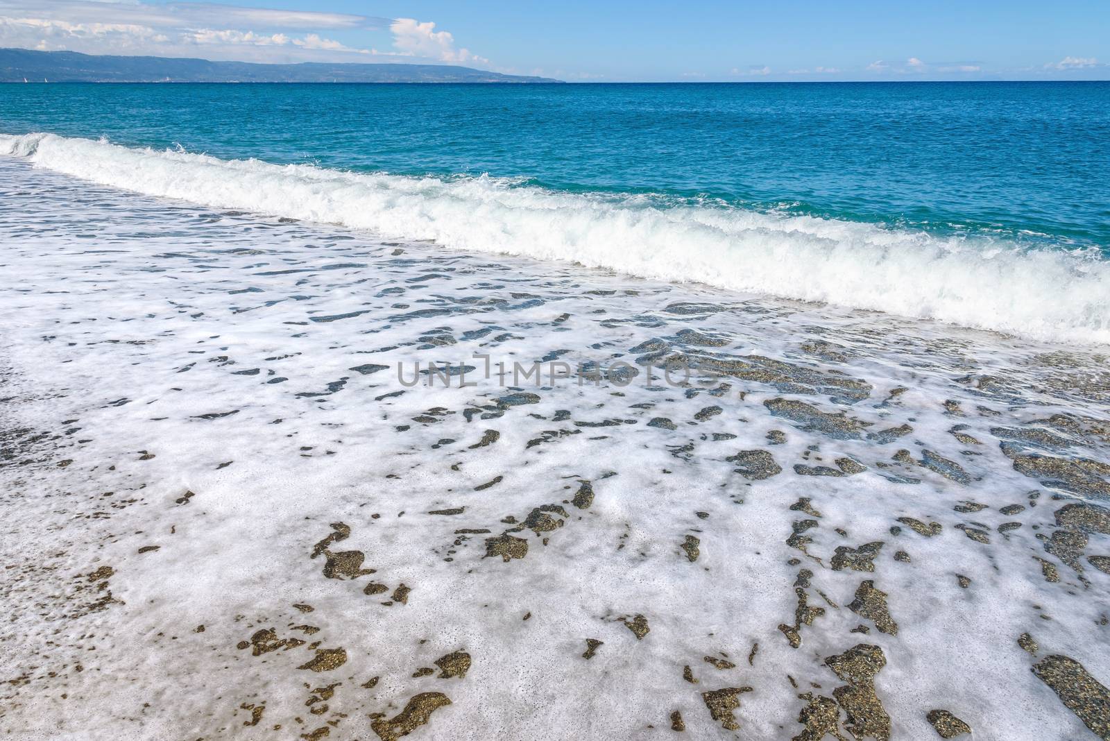 Summer background made of sea wave with withe foam