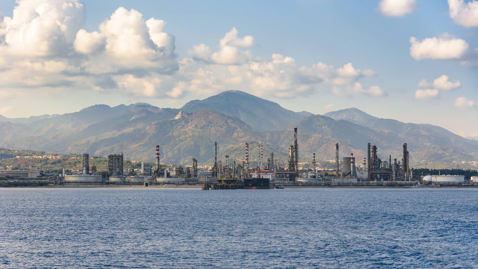 Industrial zone in Milazzo town on Sicily seen from the sea, Italy