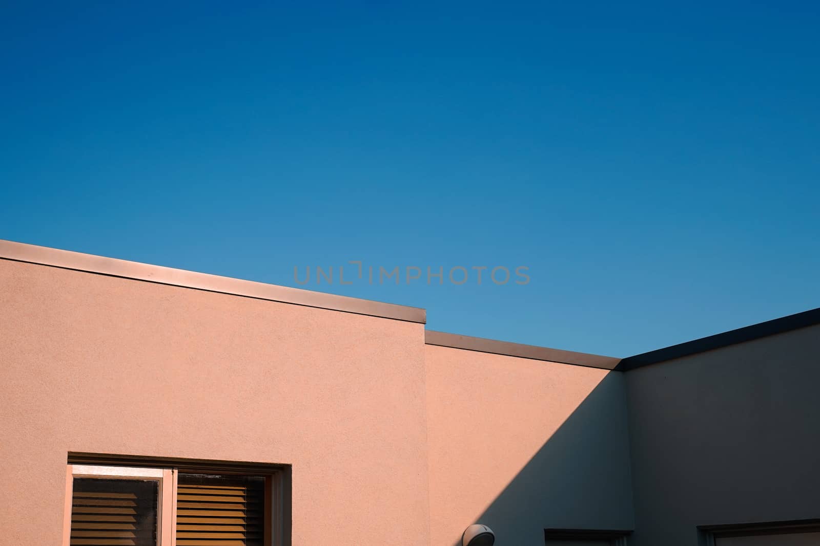 Modern and minimal residential building with light and shadow, summer background