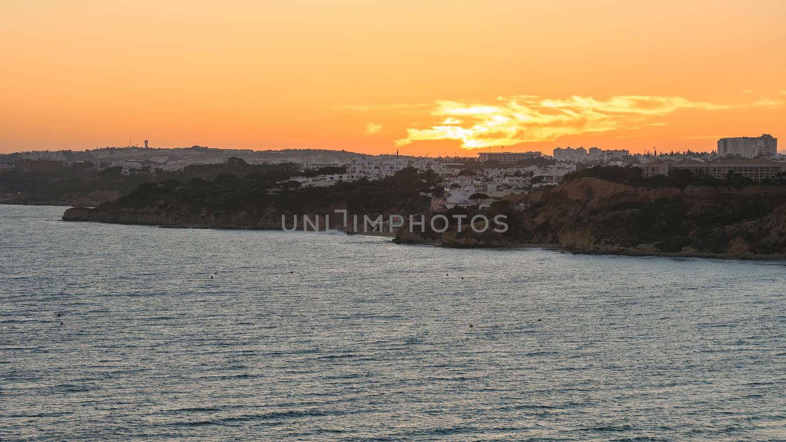 Atlantic coastline in Algarve region in Portugal at dusk