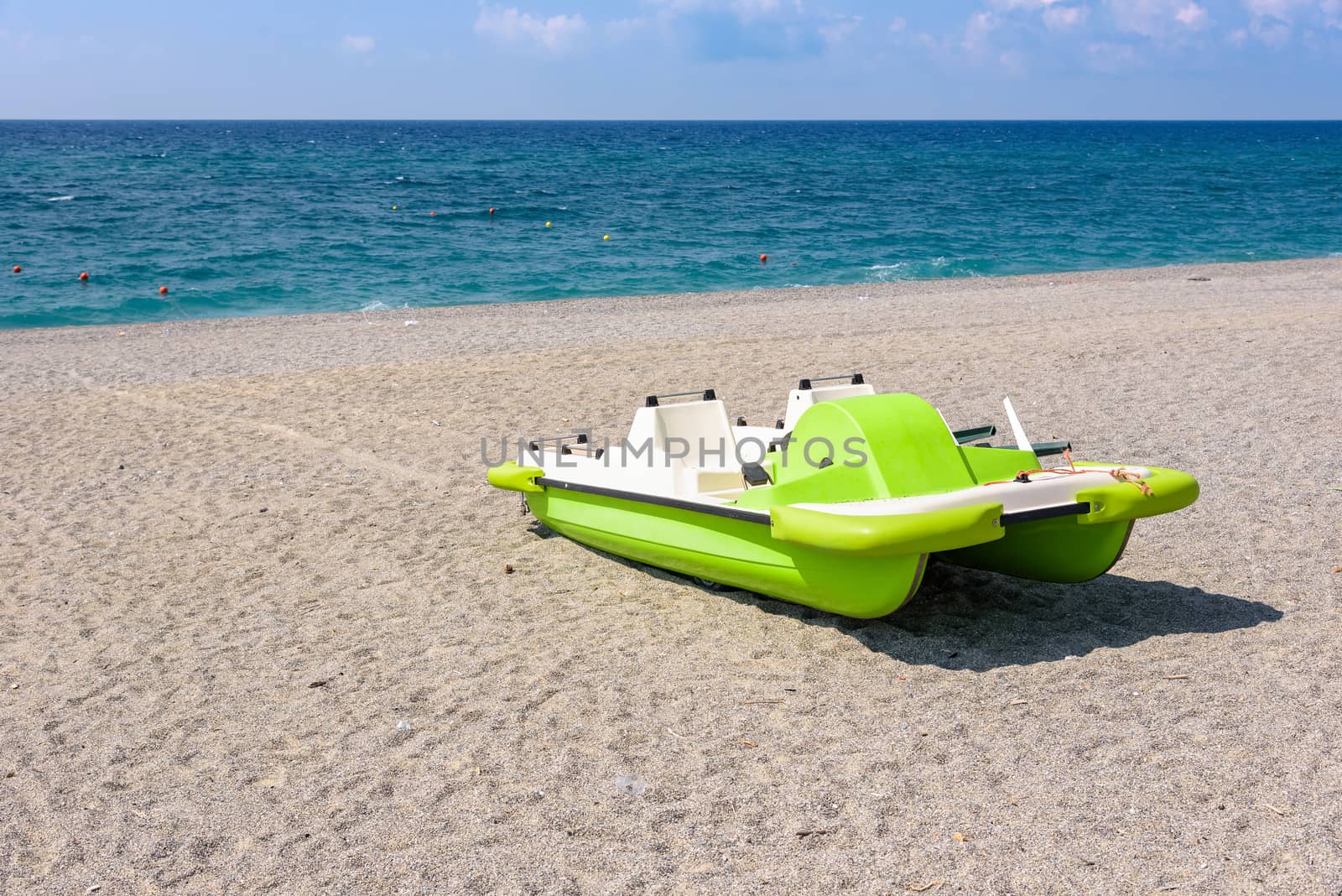 Pedalo on a gravel beach by mkos83