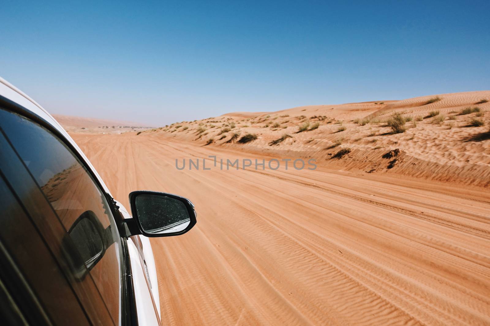 Point of view from the window off-Road car ride on road in desert area, Oman  