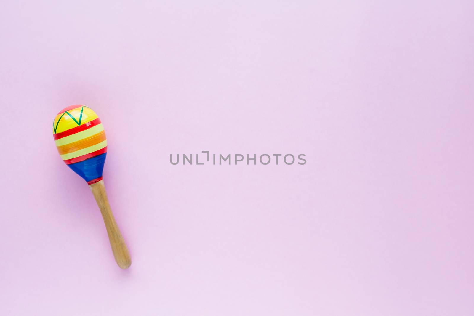 Maracas on pink background for baby toy musical instrument, hobbies, learning and education concept