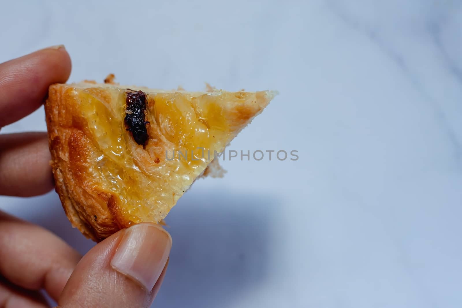 Top view of delicious bread on white marble background for food, bakery and eating concept