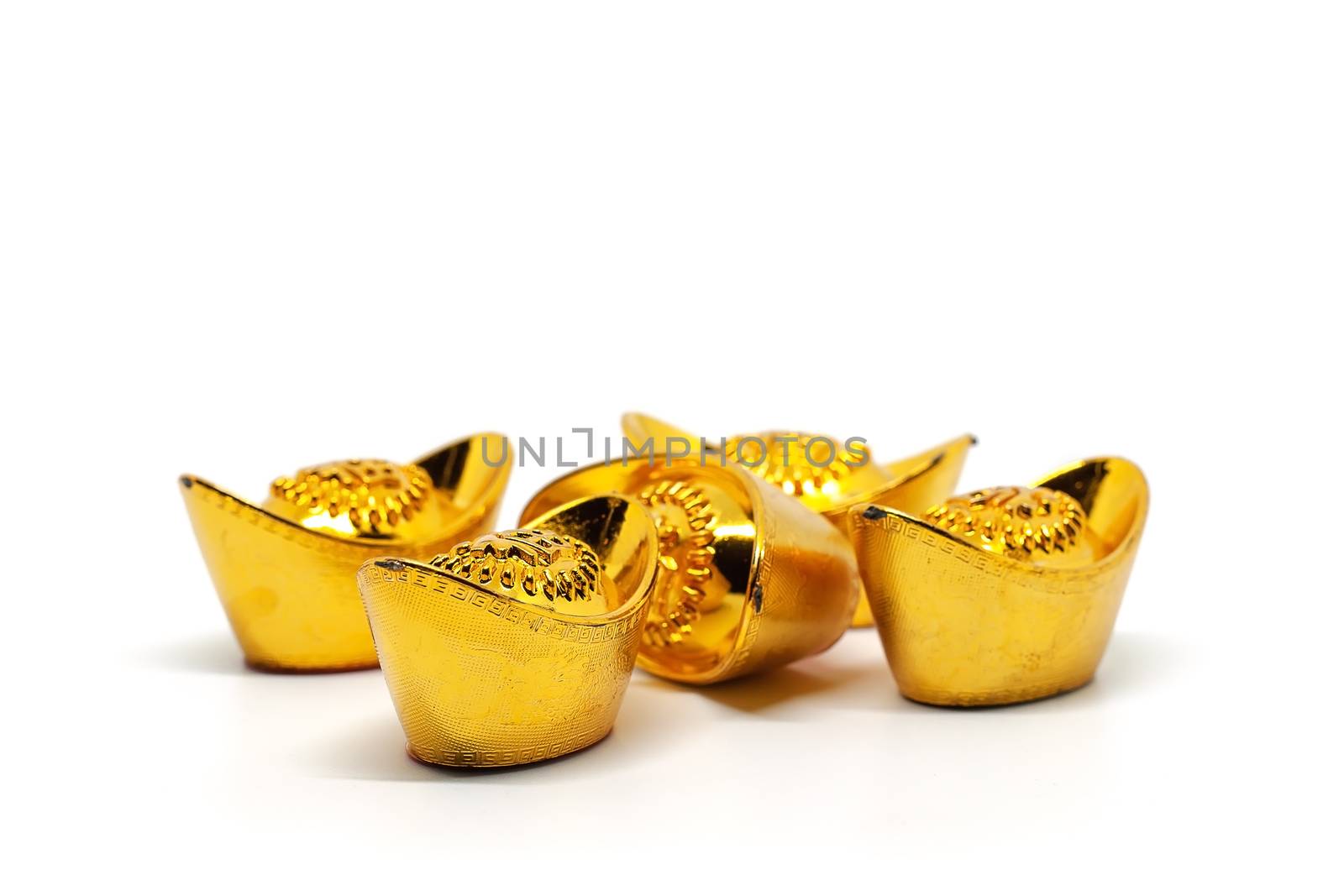 Chinese gold sycee or yuanbao boat ingot with text on top means fortune, prosperity and happiness on white background for investment, business and finance concept