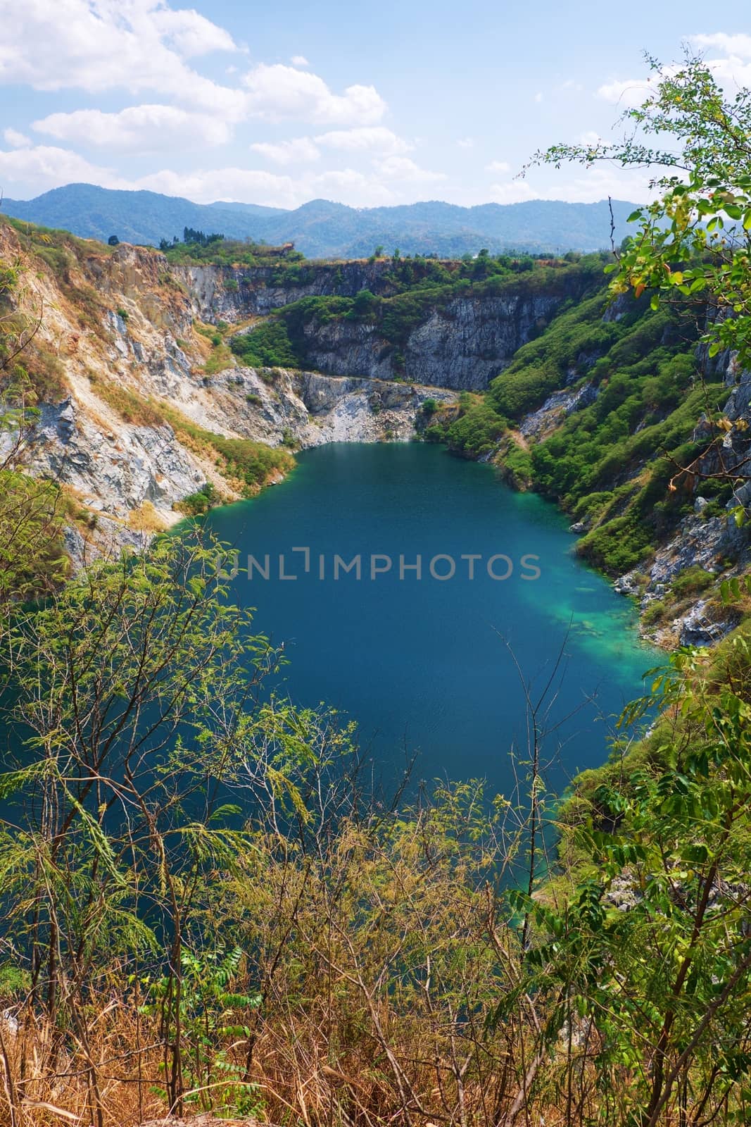 Beautiful scenic of a mining quarry with a waterlogging area by iamnoonmai