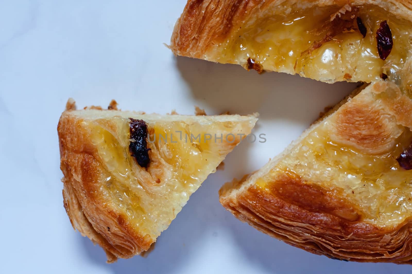 Top view of delicious bread on white marble background for food, bakery and eating concept