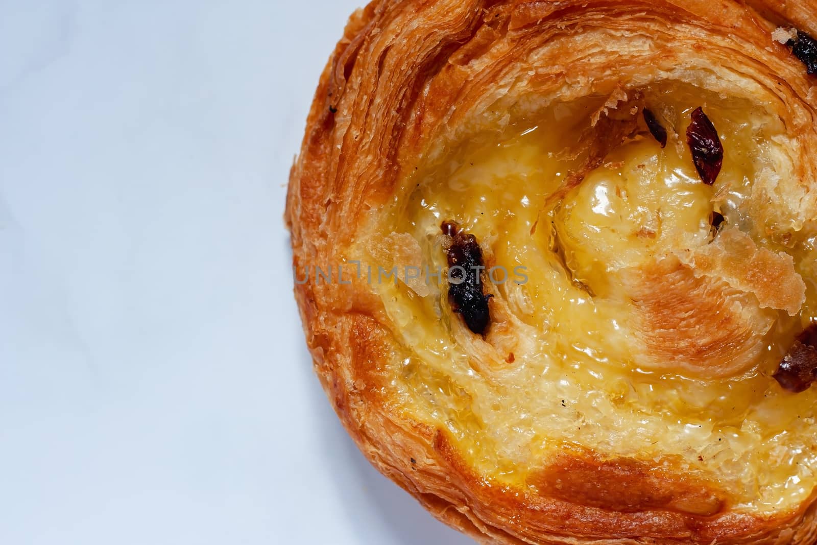 Top view of delicious bread on white marble background for food, bakery and eating concept