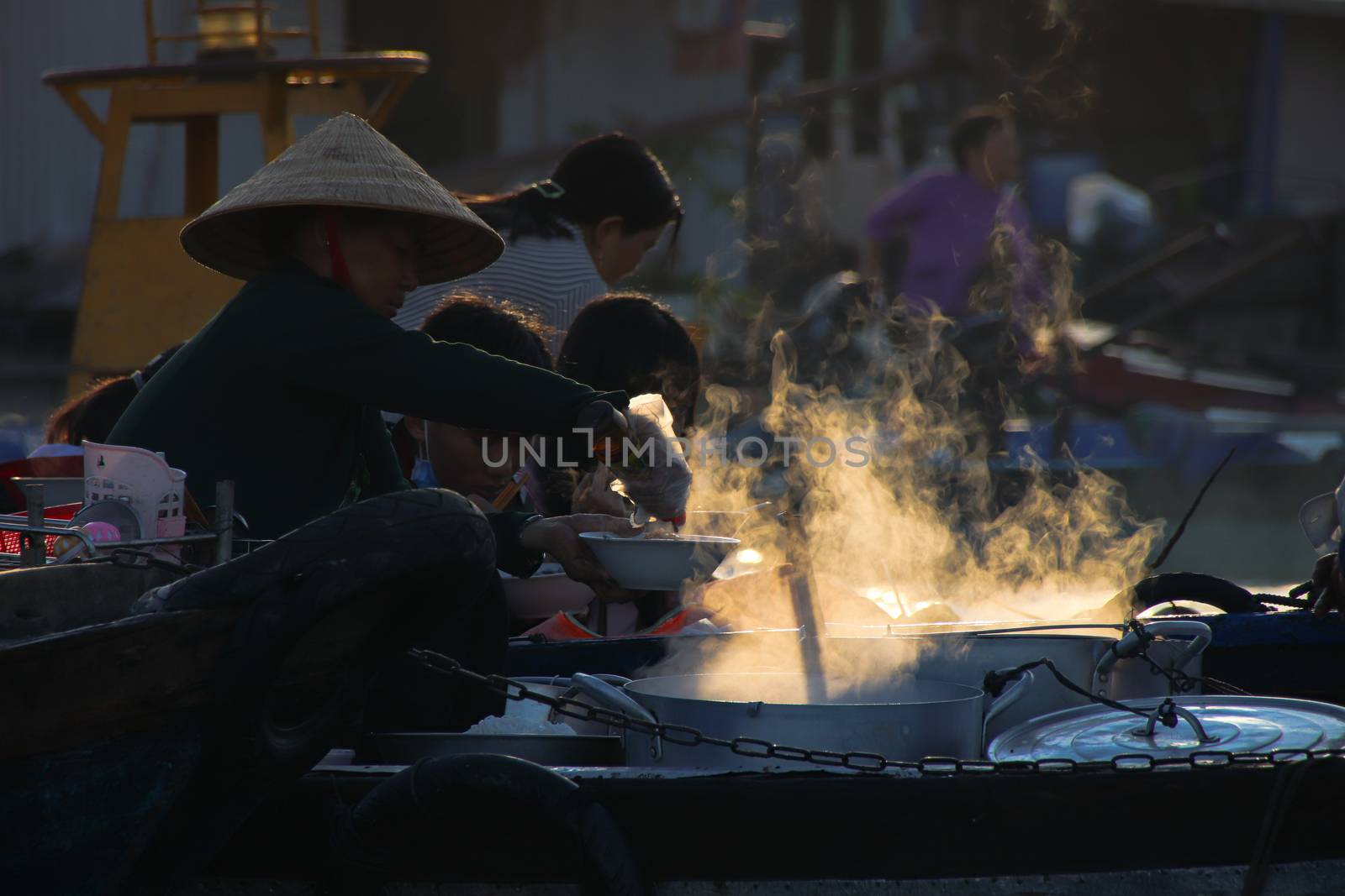 Editorial. Food vendors selling Vietnamese noodle soups in small wooden boats by Sonnet15