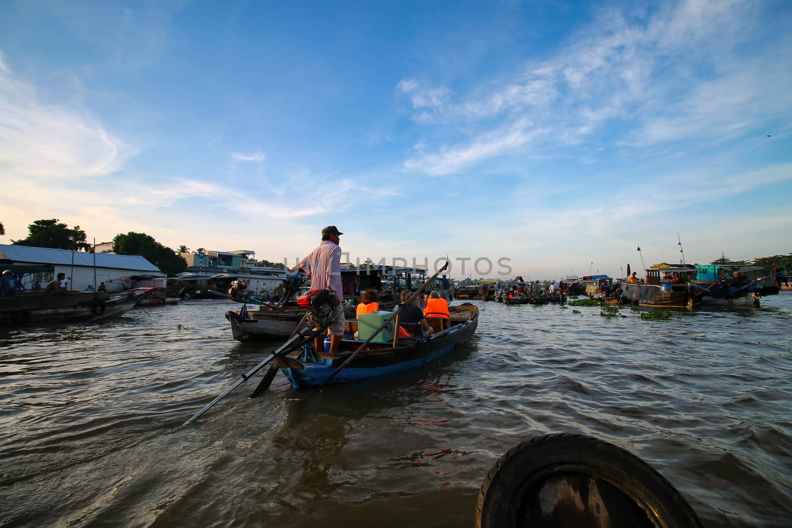 Everyday life in Cai Rang Floating Market in Can tho, Vietnam which is a popular tourist destination and considered to be the largest traditional floating market in Asia